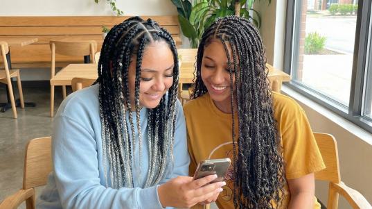 A high-resolution, split-screen comparison showing the visual difference between traditional box braids with visible knots at the scalp on the left, and seamless, tension-free knotless braids using the feed-in method